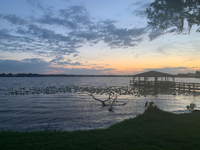 dock area with a water view and a gazebo