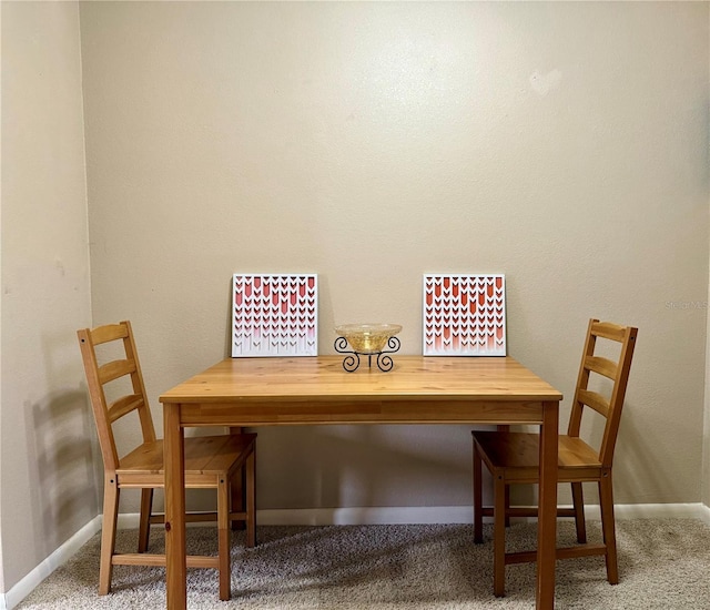 view of carpeted dining area