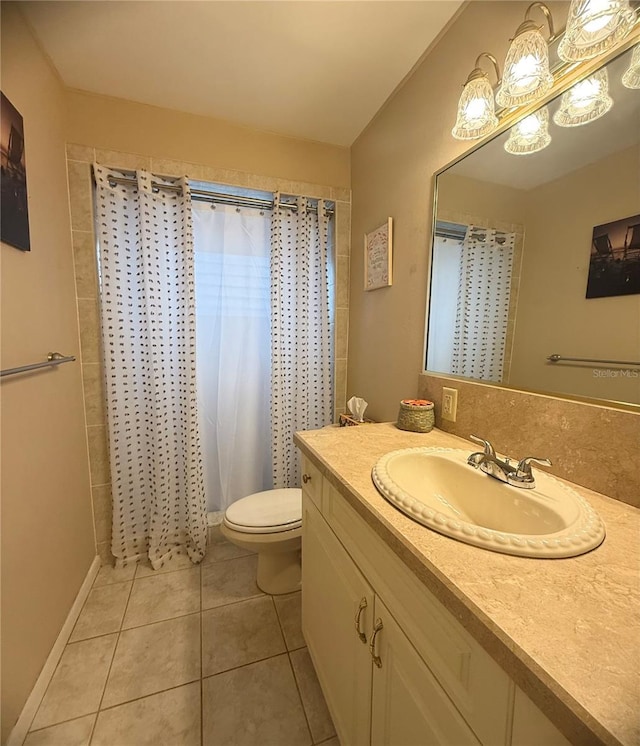 bathroom featuring curtained shower, toilet, vanity, and tile patterned flooring