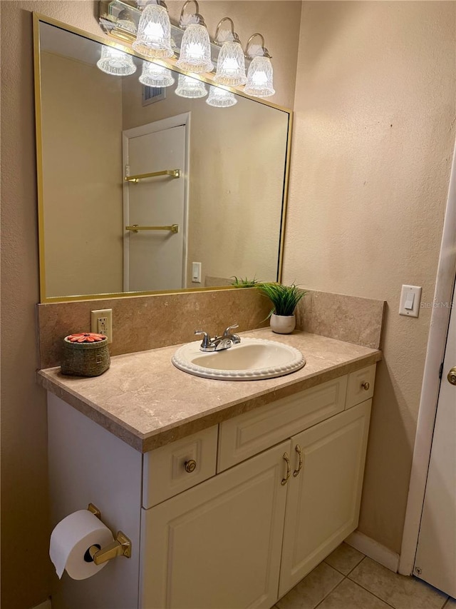 bathroom with vanity and tile patterned flooring