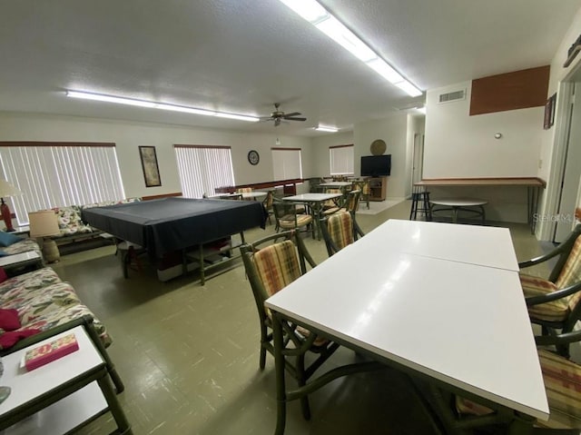 playroom featuring a textured ceiling, ceiling fan, and pool table