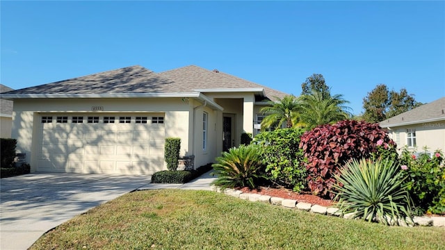 view of front facade featuring a front yard and a garage