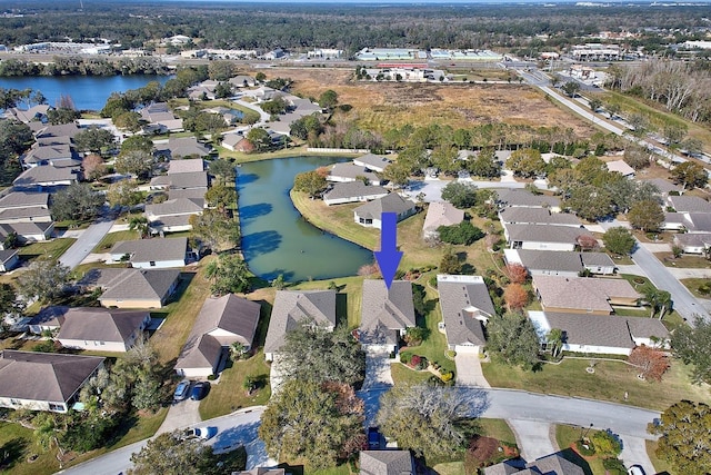 birds eye view of property with a water view