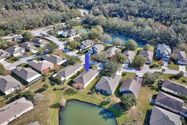 birds eye view of property with a water view