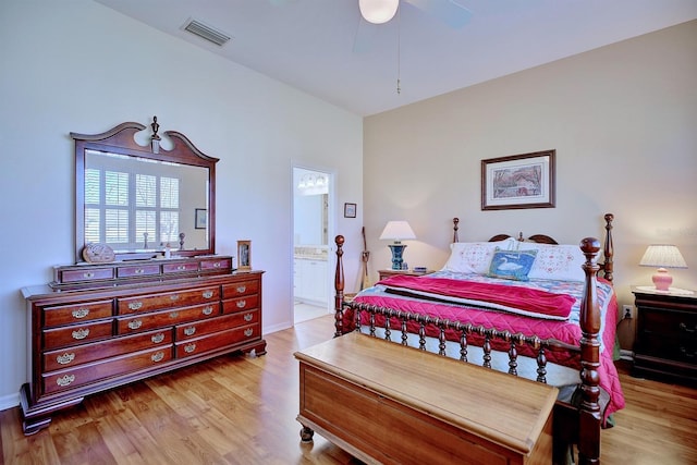 bedroom with ceiling fan, light hardwood / wood-style floors, and connected bathroom