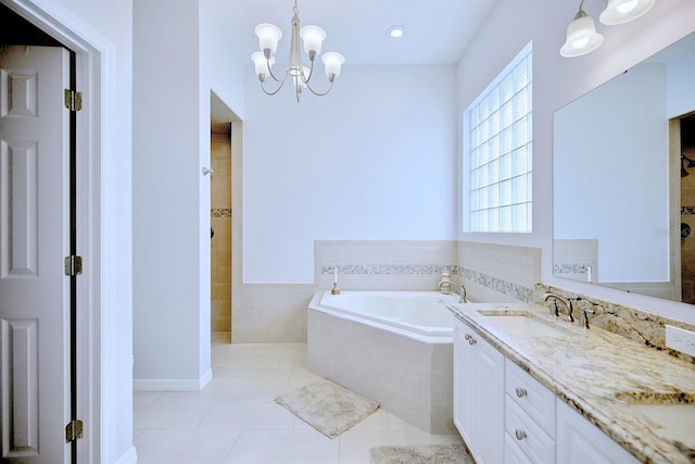 bathroom featuring a notable chandelier, tile patterned flooring, plus walk in shower, and vanity