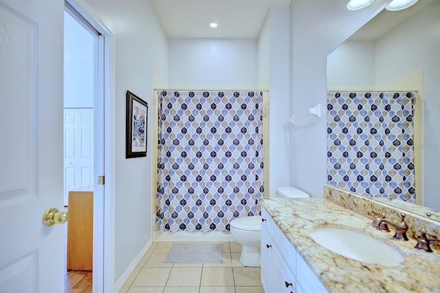 bathroom with tile patterned floors, vanity, and toilet