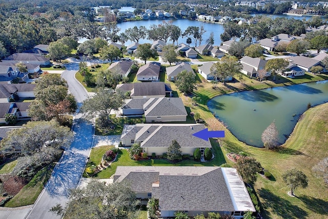 birds eye view of property with a water view