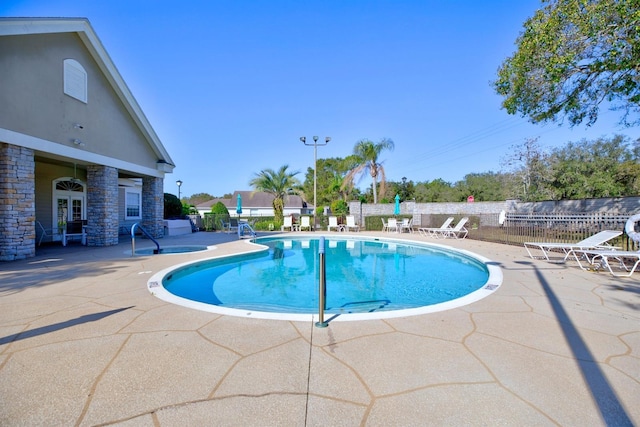 view of swimming pool featuring a patio