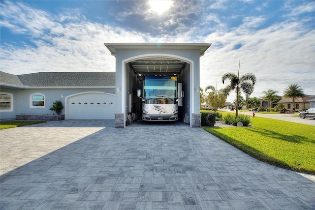 view of front of home with a garage and a front yard