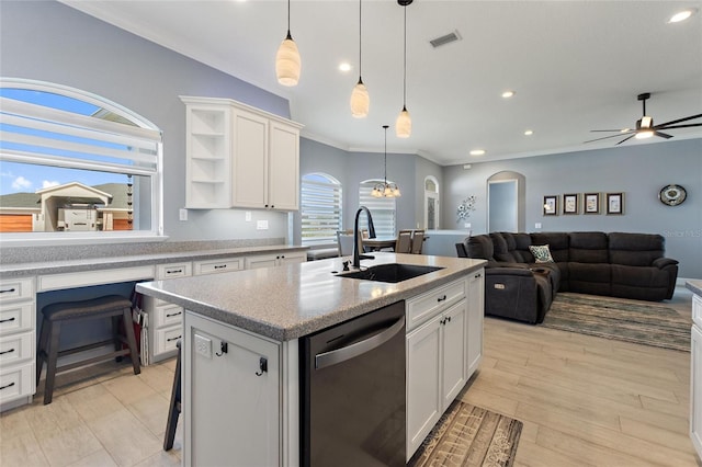 kitchen with white cabinetry, a kitchen island with sink, sink, dishwashing machine, and pendant lighting