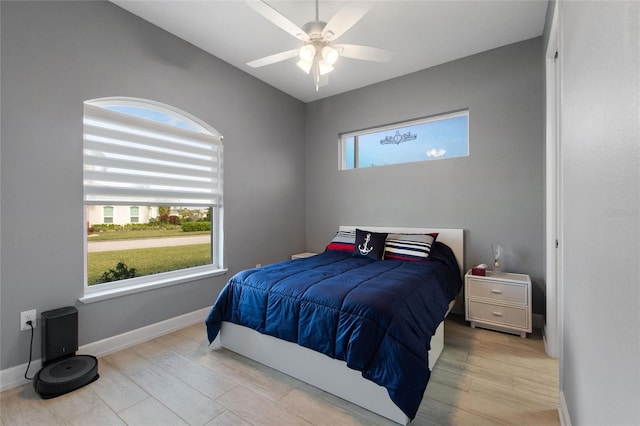 bedroom featuring light hardwood / wood-style floors and ceiling fan