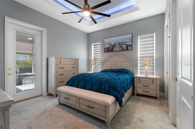 bedroom featuring ceiling fan, light colored carpet, and access to outside