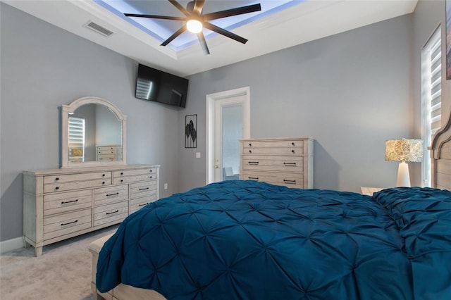 bedroom with light colored carpet and ceiling fan