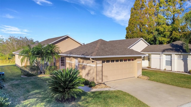 view of front of home with a front yard and a garage