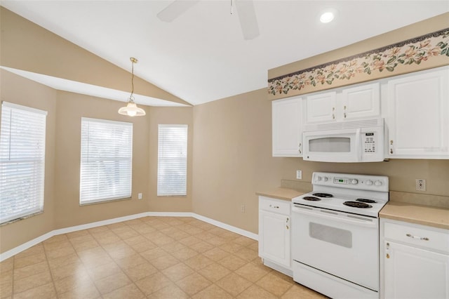 kitchen featuring white appliances, white cabinetry, and hanging light fixtures