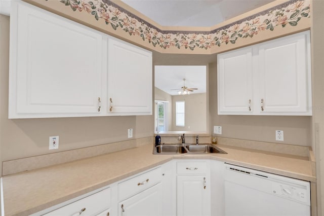 kitchen featuring sink, ceiling fan, dishwasher, and white cabinetry