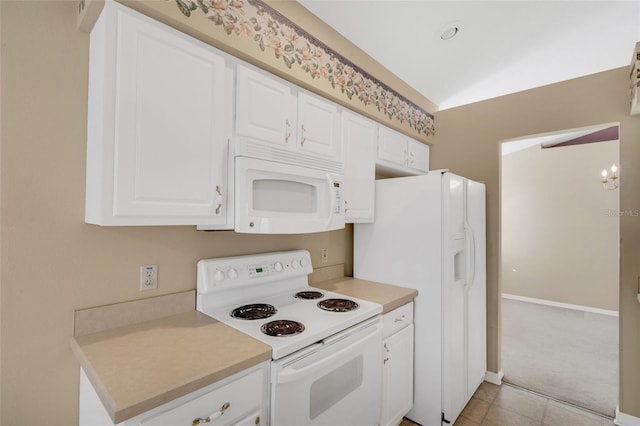 kitchen featuring white appliances, light colored carpet, white cabinetry, and an inviting chandelier