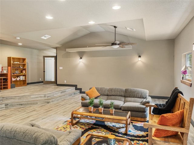 living room featuring ceiling fan, lofted ceiling, and hardwood / wood-style floors