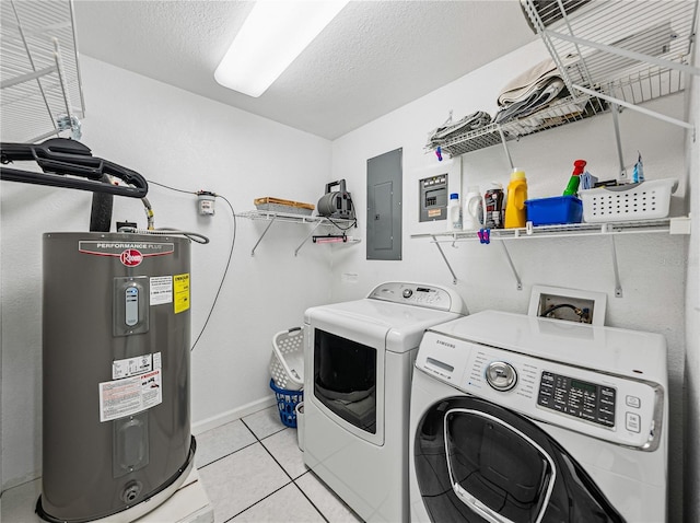 washroom featuring washer and dryer, electric panel, water heater, a textured ceiling, and light tile patterned floors