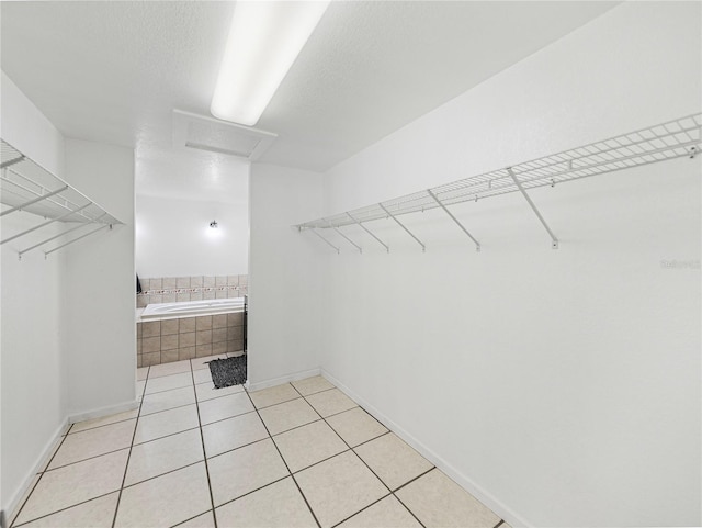 walk in closet featuring light tile patterned floors