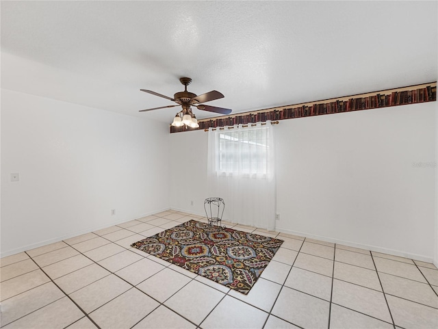 tiled empty room with ceiling fan