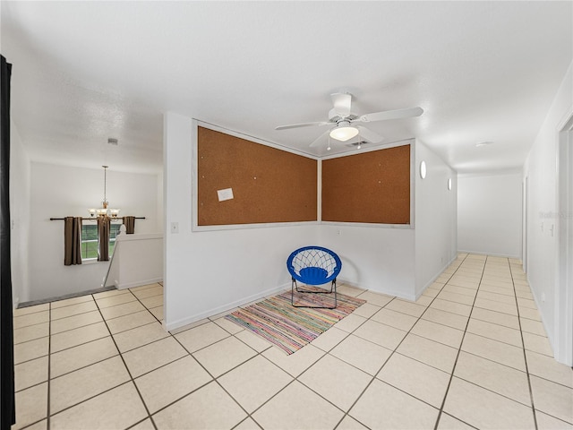 interior space with light tile patterned flooring and a chandelier