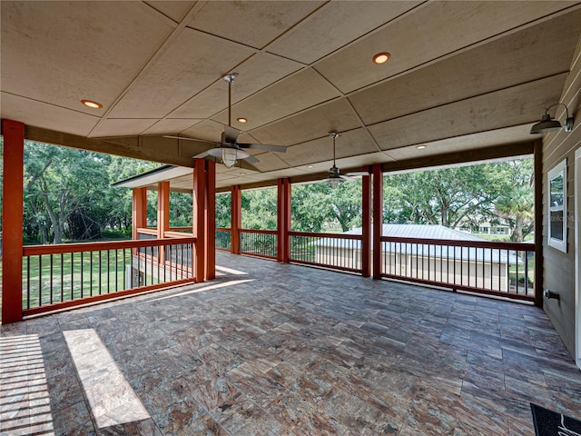 wooden deck featuring ceiling fan