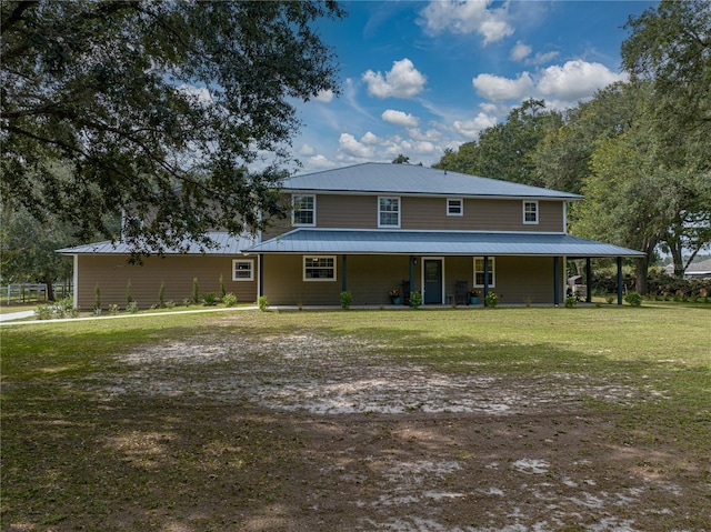 back of house featuring a yard