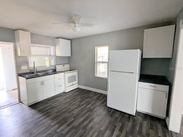 kitchen featuring white appliances, dark hardwood / wood-style floors, white cabinets, ceiling fan, and sink