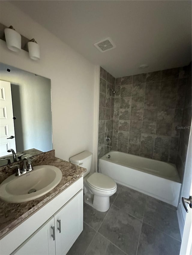 bathroom featuring tile patterned flooring, toilet, bathtub / shower combination, vanity, and visible vents