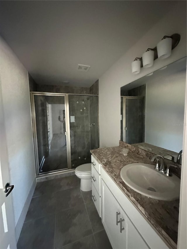 full bathroom featuring visible vents, toilet, tile patterned flooring, vanity, and a shower stall