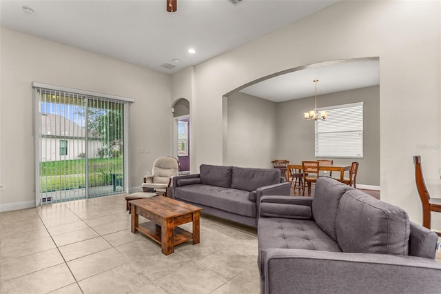 living room featuring light tile patterned floors and a chandelier