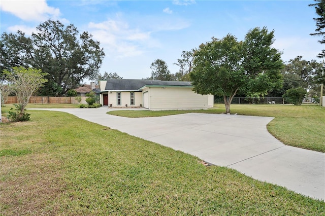 ranch-style house with a front lawn