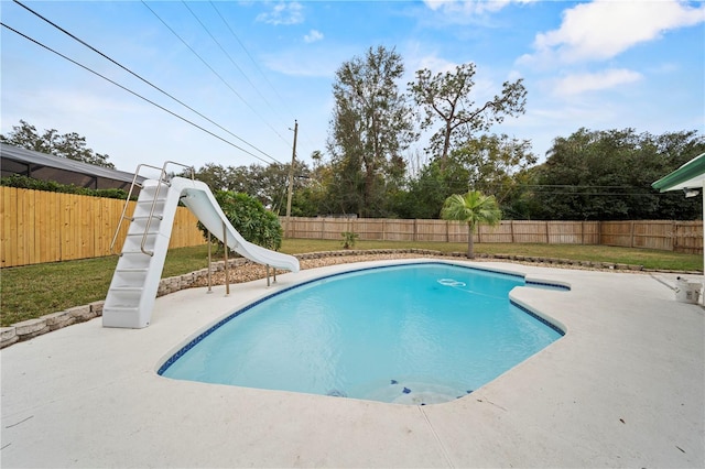 view of pool featuring a patio area and a water slide