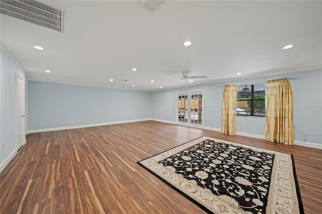 unfurnished living room featuring ceiling fan, ornamental molding, and hardwood / wood-style flooring