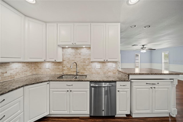 kitchen featuring ceiling fan, white cabinetry, and stainless steel dishwasher