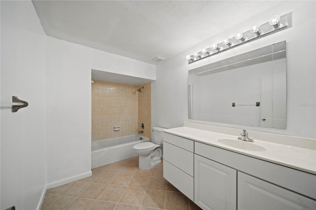 full bathroom with toilet, tiled shower / bath, tile patterned floors, a textured ceiling, and vanity