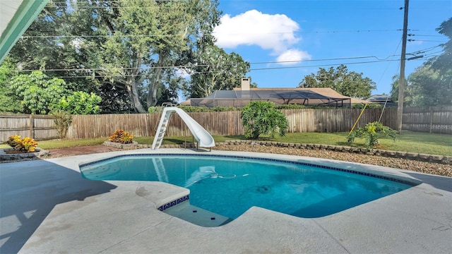 view of swimming pool with a water slide