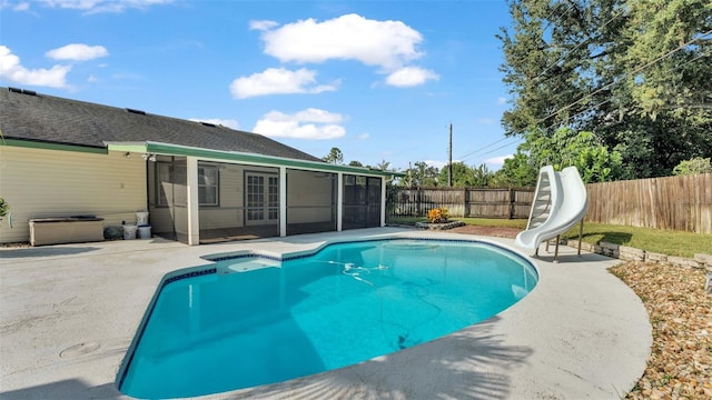 view of pool featuring a patio area, a sunroom, and a water slide