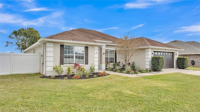 view of front of house with a front yard and a garage