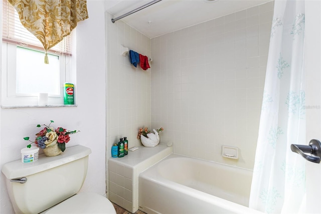 full bathroom with shower / tub combo and toilet