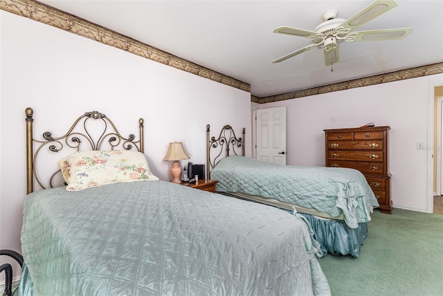 bedroom with baseboards, carpet floors, and a ceiling fan