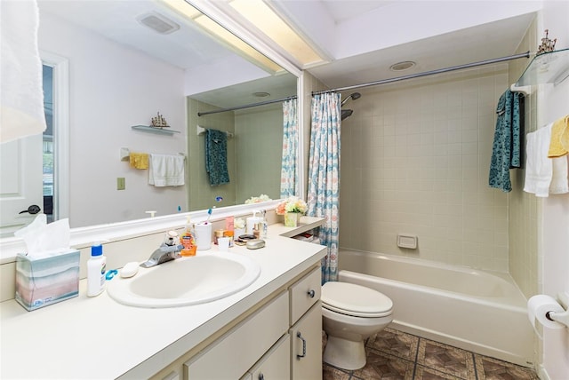 bathroom featuring visible vents, toilet, vanity, and shower / bath combination with curtain