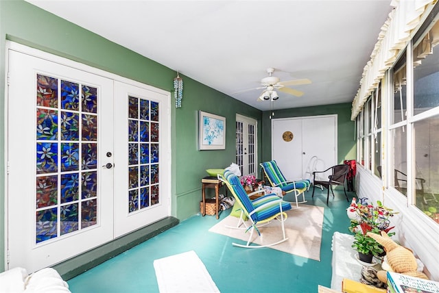 sunroom / solarium with french doors and ceiling fan