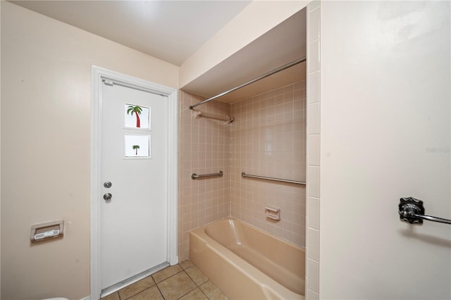 bathroom with tiled shower / bath and tile patterned floors