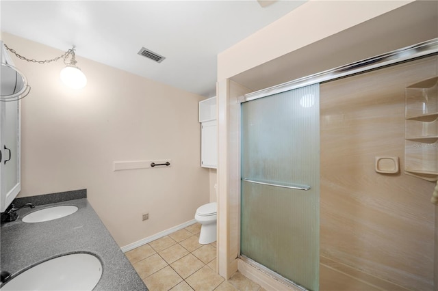 bathroom with toilet, tile patterned floors, walk in shower, and vanity