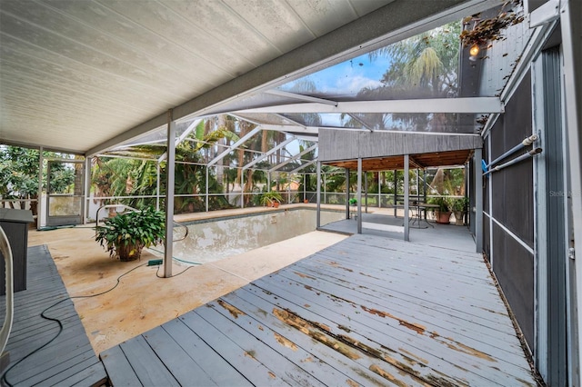 wooden deck featuring glass enclosure