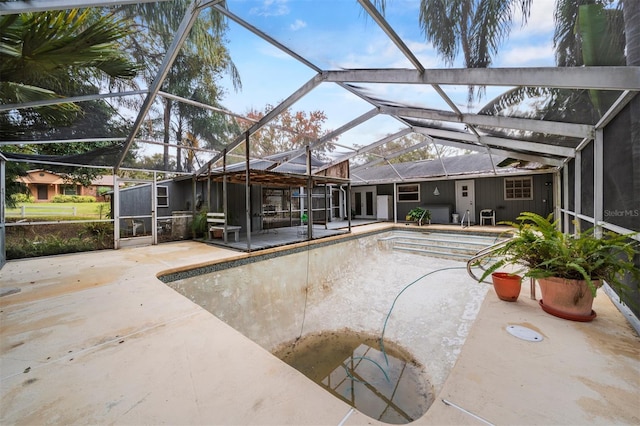 view of pool featuring a lanai and a patio