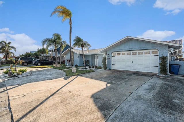 ranch-style house featuring a garage